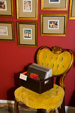 gold victorian chair with box of matted photographs inside the shutter gallery kennebunk maine