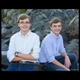 high school age brothers photographed sitting on rocks at the beach kennebunk maine